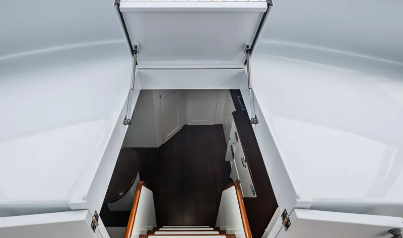  Yacht Photos Pics Stairway leading to cabin interior of 2005 Gamefisherman 45 Express boat.