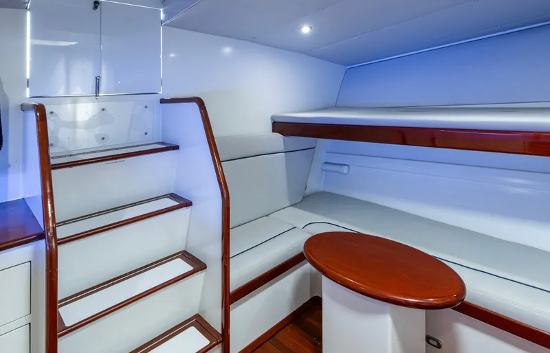  Yacht Photos Pics Interior of 2005 Gamefisherman 45 Express yacht with seating and wooden accents.