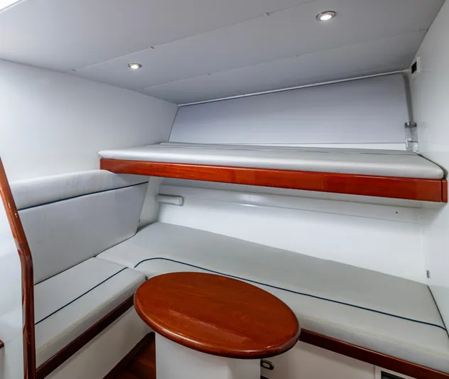  Yacht Photos Pics 2005 Gamefisherman 45 Express cabin interior with wooden accents and cushioned seating.