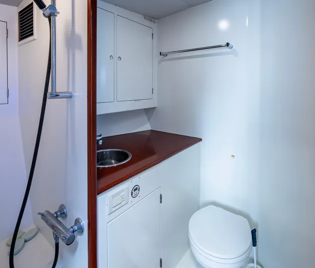  Yacht Photos Pics 2005 Gamefisherman 45 Express yacht bathroom with shower, sink, and toilet.