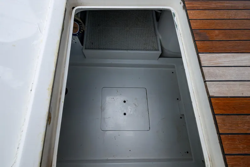  Yacht Photos Pics Open storage compartment on 2005 Gamefisherman 45 Express boat with wooden deck.