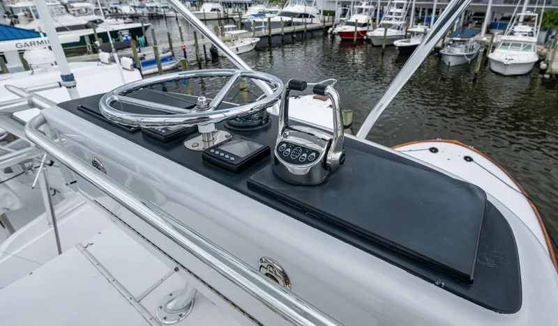  Yacht Photos Pics Helm of 2005 Gamefisherman 45 Express boat with steering wheel and controls.