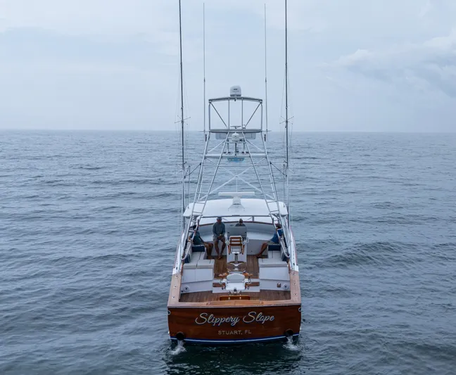  Yacht Photos Pics 2005 Gamefisherman 45 Express boat on open sea, rear view.