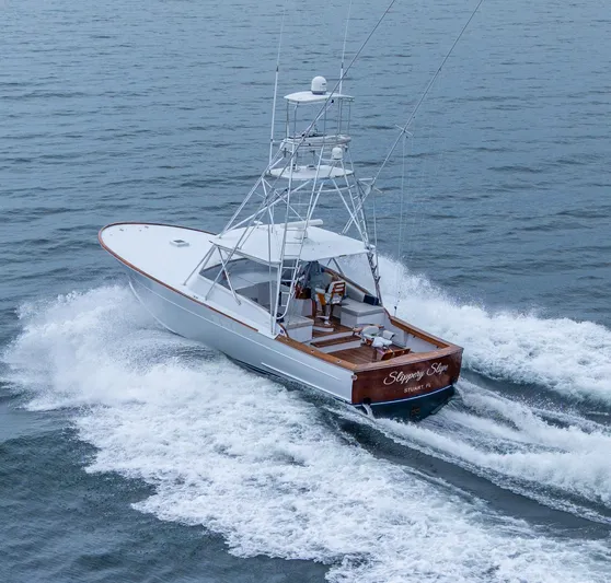  Yacht Photos Pics 2005 Gamefisherman 45 Express boat cruising on open water.