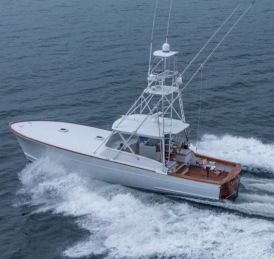  Yacht Photos Pics 2005 Gamefisherman 45 Express yacht cruising on open water.