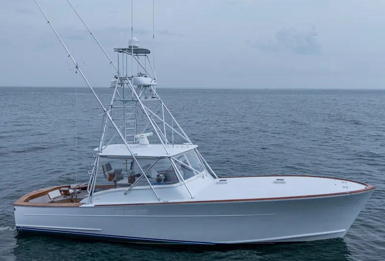  Yacht Photos Pics 2005 Gamefisherman 45 Express boat on open sea, side view.