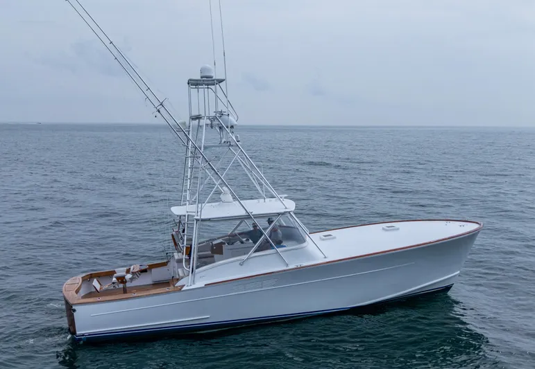  Yacht Photos Pics 2005 Gamefisherman 45 Express boat on open water, side view.