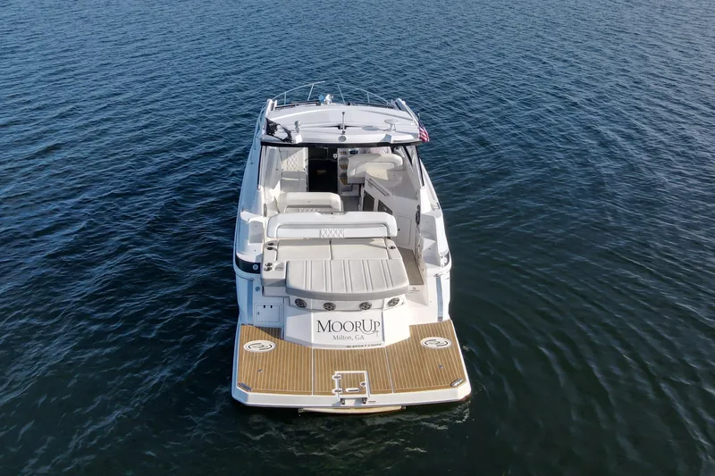  Yacht Photos Pics 2019 Regal 35 Sport Coupe on calm water, rear view.