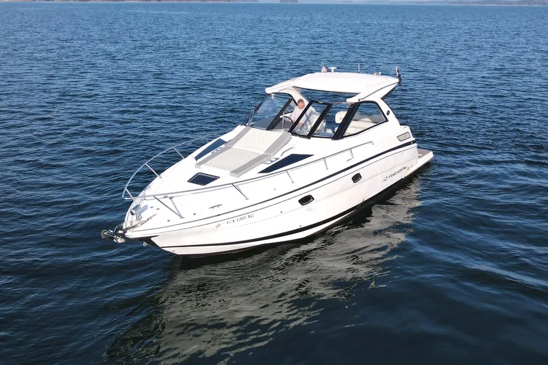  Yacht Photos Pics 2019 Regal 35 Sport Coupe cruising on open water.
