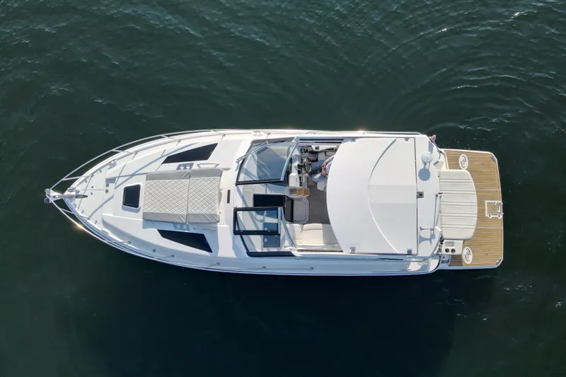  Yacht Photos Pics Overhead view of 2019 Regal 35 Sport Coupe yacht on water.