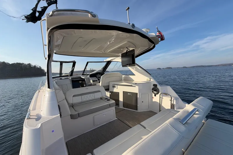  Yacht Photos Pics 2019 Regal 35 Sport Coupe boat interior on a serene lake.