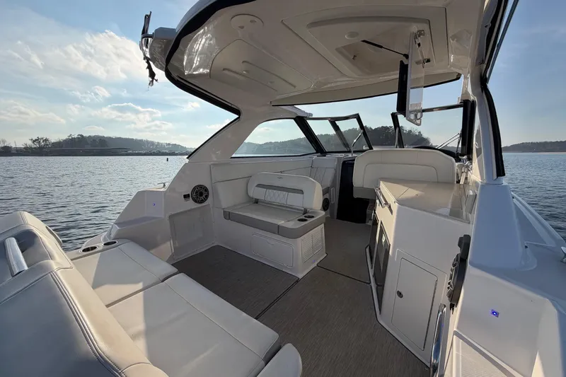  Yacht Photos Pics 2019 Regal 35 Sport Coupe interior with luxurious seating on a serene lake.