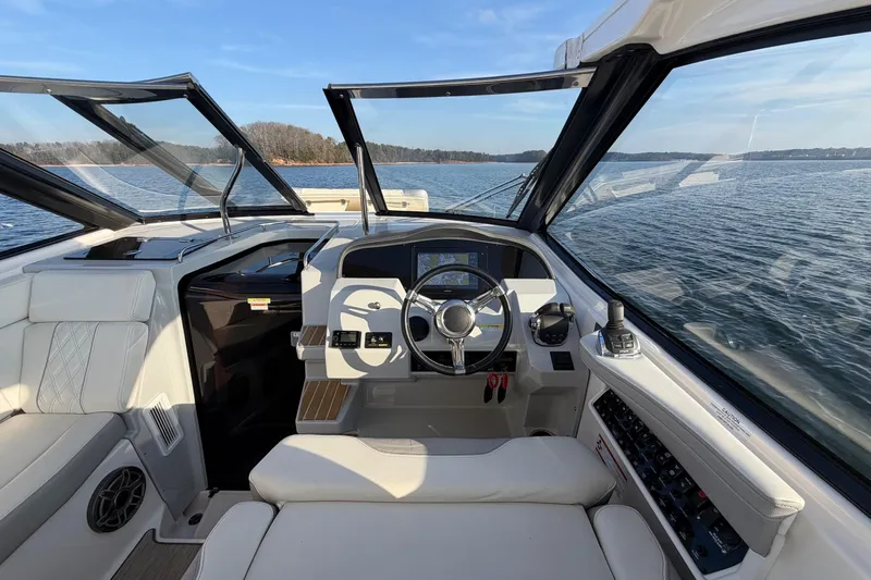  Yacht Photos Pics 2019 Regal 35 Sport Coupe helm with panoramic water view.