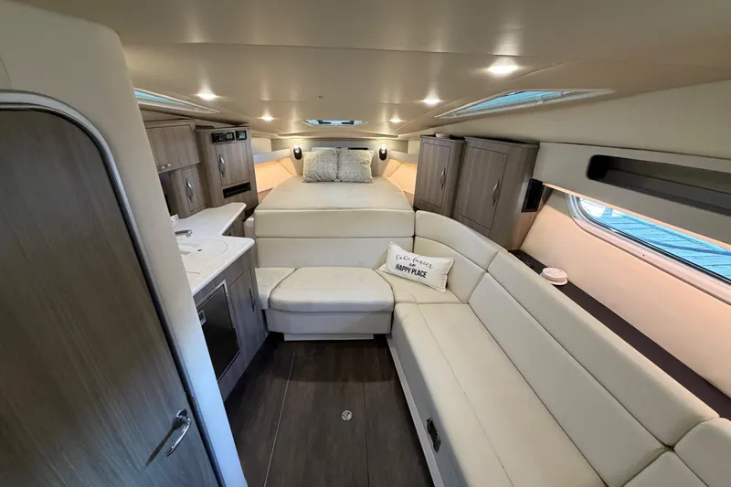  Yacht Photos Pics Luxurious interior of 2019 Regal 35 Sport Coupe with modern furnishings and cozy seating.