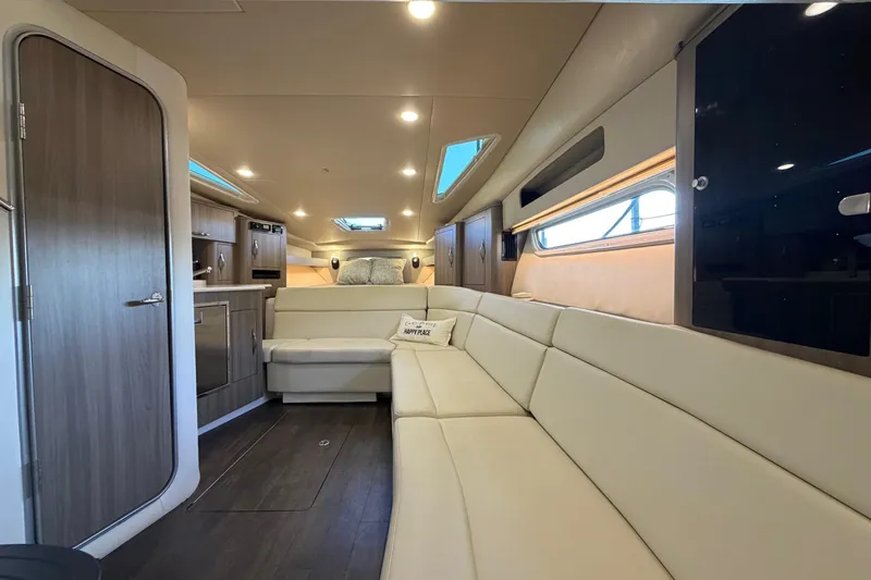  Yacht Photos Pics Luxurious interior of 2019 Regal 35 Sport Coupe with modern seating and elegant design.