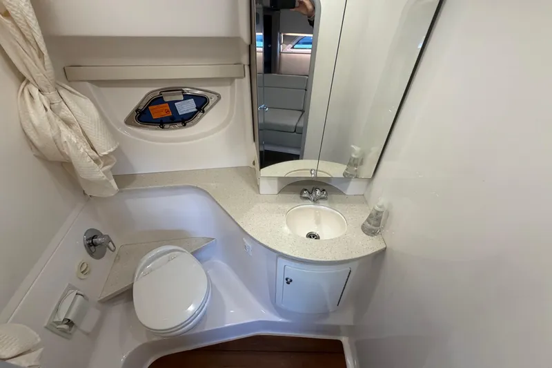  Yacht Photos Pics Bathroom interior of 2019 Regal 35 Sport Coupe yacht, featuring sink and toilet.