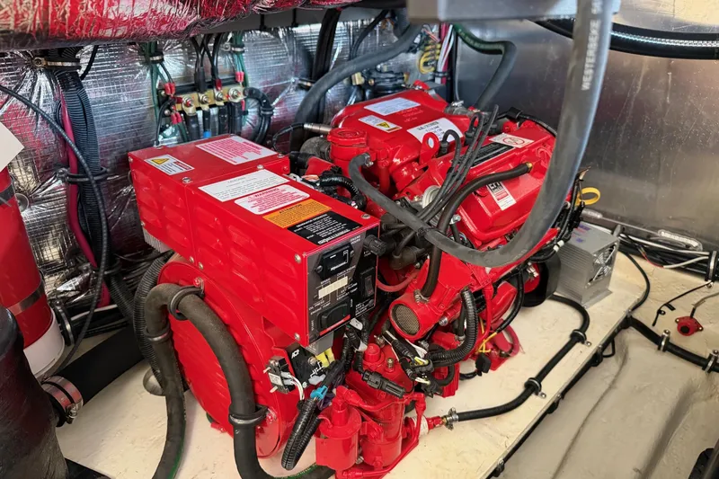  Yacht Photos Pics Engine room of 2019 Regal 35 Sport Coupe with red machinery and wiring.