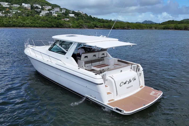  Yacht Photos Pics 2003 Tiara Yachts 4000 Express cruising on a scenic waterway.