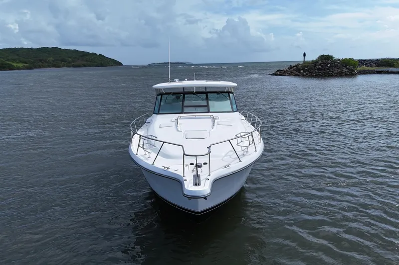  Yacht Photos Pics 2003 Tiara Yachts 4000 Express cruising on a scenic waterway.