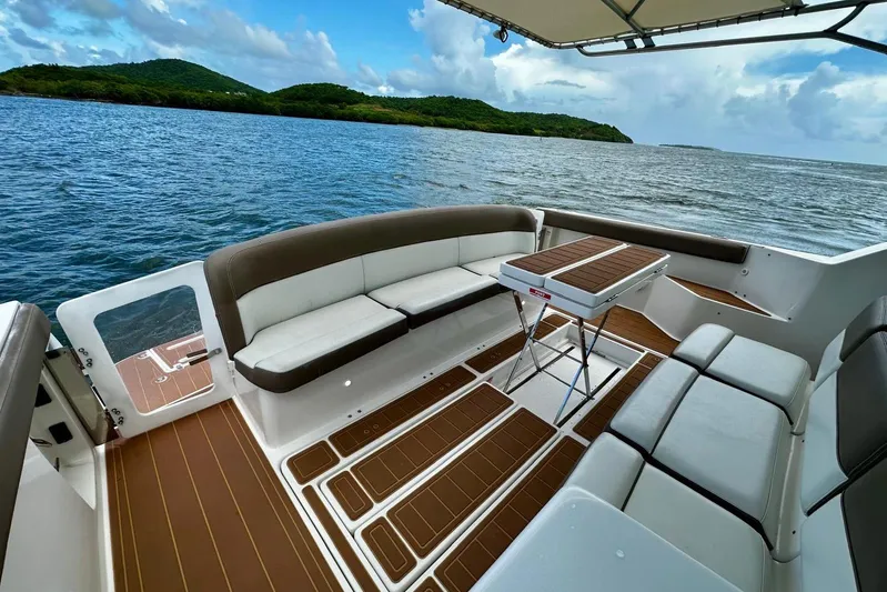  Yacht Photos Pics 2003 Tiara Yachts 4000 Express boat interior with seating and table, overlooking scenic water.