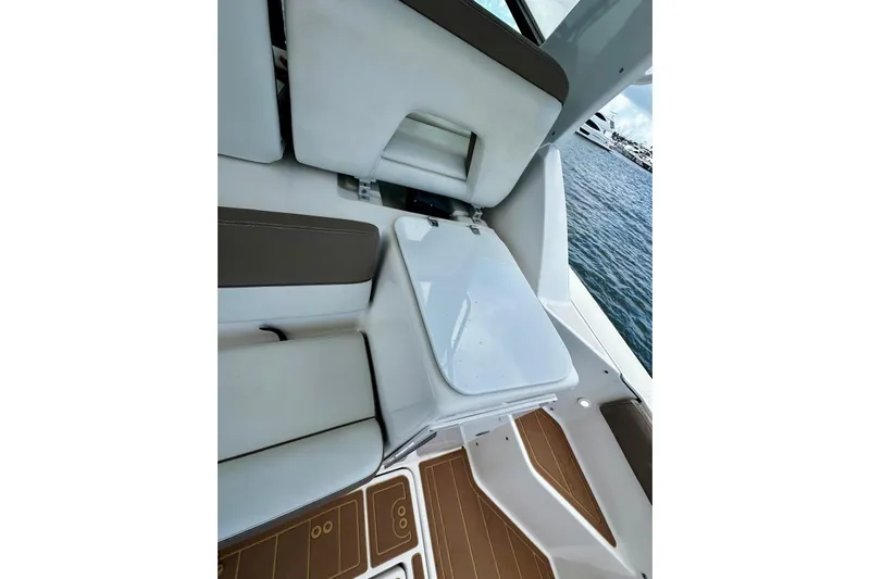  Yacht Photos Pics 2003 Tiara Yachts 4000 Express interior with white seating and wooden flooring.