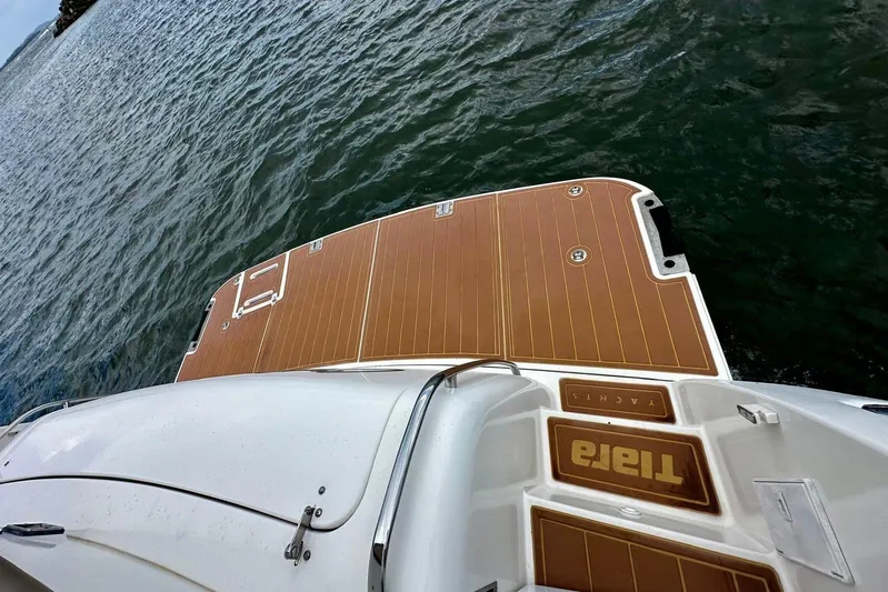  Yacht Photos Pics 2003 Tiara Yachts 4000 Express boat deck on water, showcasing elegant design.