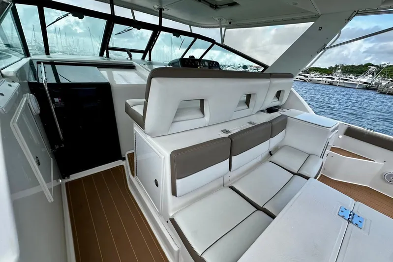  Yacht Photos Pics 2003 Tiara Yachts 4000 Express interior with seating, docked at marina.