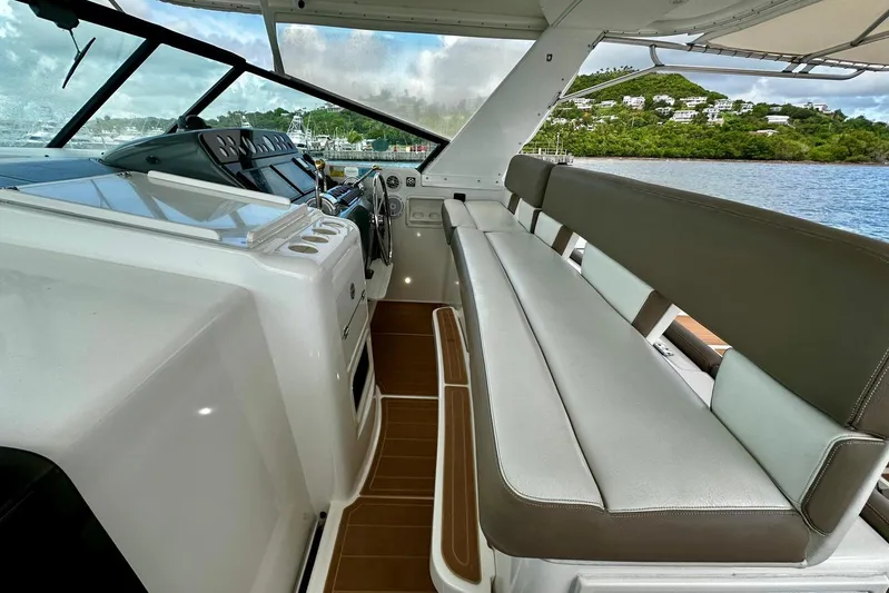  Yacht Photos Pics 2003 Tiara Yachts 4000 Express interior with helm and seating, overlooking scenic water view.