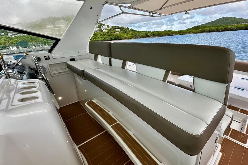  Yacht Photos Pics Luxurious seating area on a 2003 Tiara Yachts 4000 Express, overlooking serene waters.