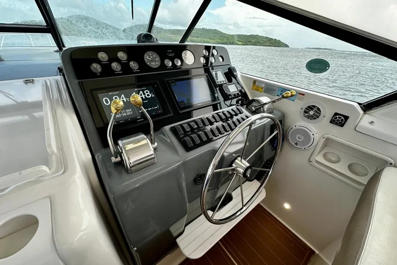  Yacht Photos Pics 2003 Tiara Yachts 4000 Express helm with modern controls and scenic ocean view.