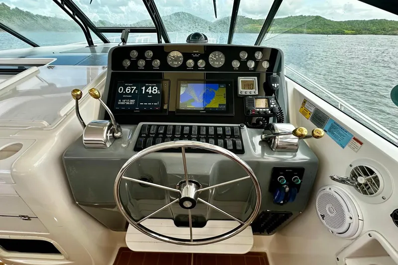  Yacht Photos Pics Helm of 2003 Tiara Yachts 4000 Express with navigation instruments and steering wheel.