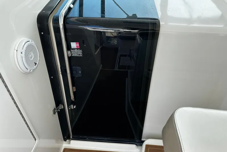  Yacht Photos Pics Cabin entrance of 2003 Tiara Yachts 4000 Express with sleek black door and speaker.