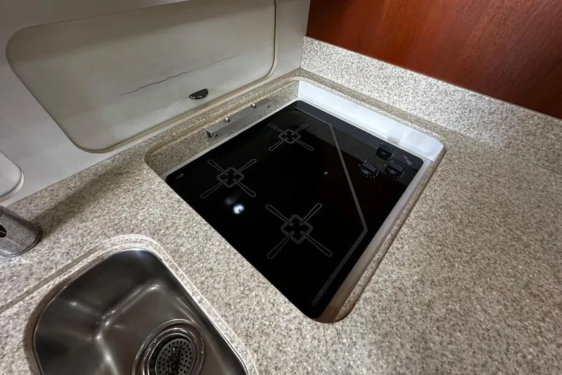  Yacht Photos Pics 2003 Tiara Yachts 4000 Express kitchen with electric stove and sink.