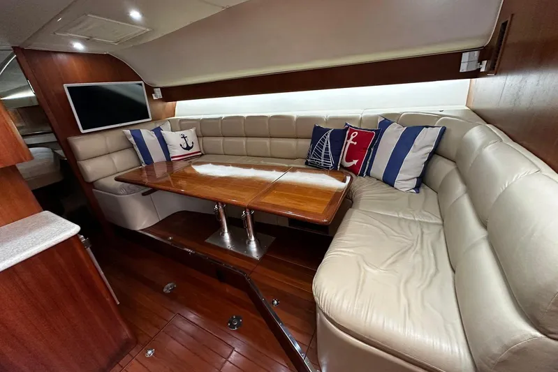  Yacht Photos Pics Luxurious 2003 Tiara Yachts 4000 Express interior with plush seating and nautical decor.