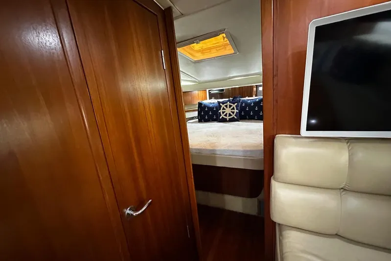  Yacht Photos Pics Luxurious cabin interior of 2003 Tiara Yachts 4000 Express with nautical-themed decor.