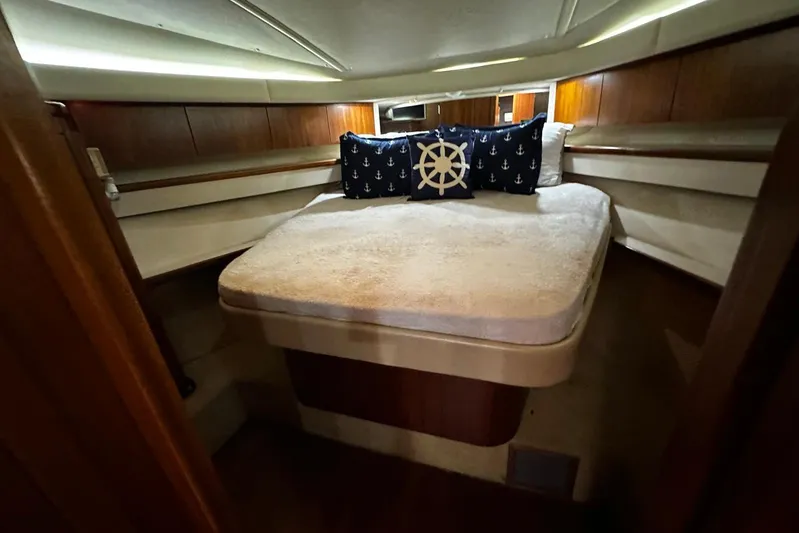  Yacht Photos Pics Cozy cabin interior of 2003 Tiara Yachts 4000 Express with nautical-themed pillows.