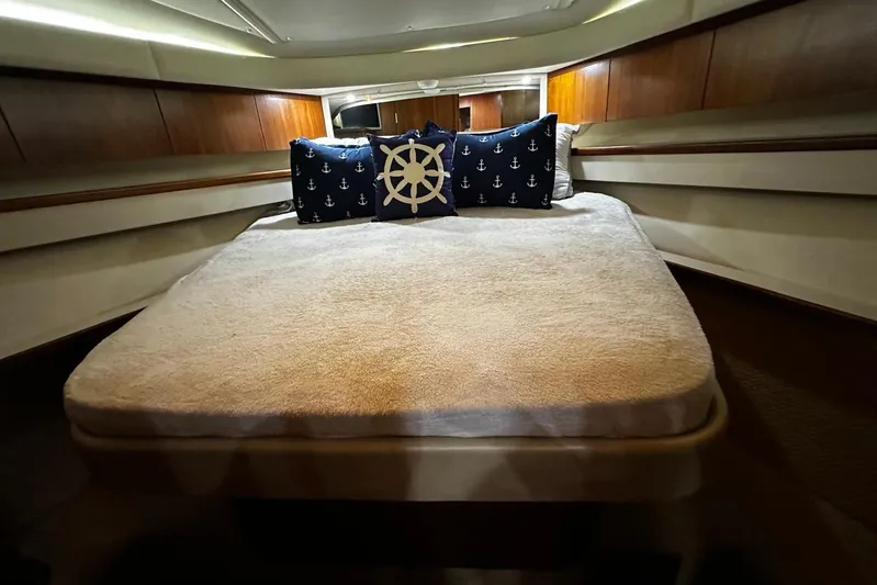  Yacht Photos Pics Luxurious cabin interior of 2003 Tiara Yachts 4000 Express with nautical-themed pillows.
