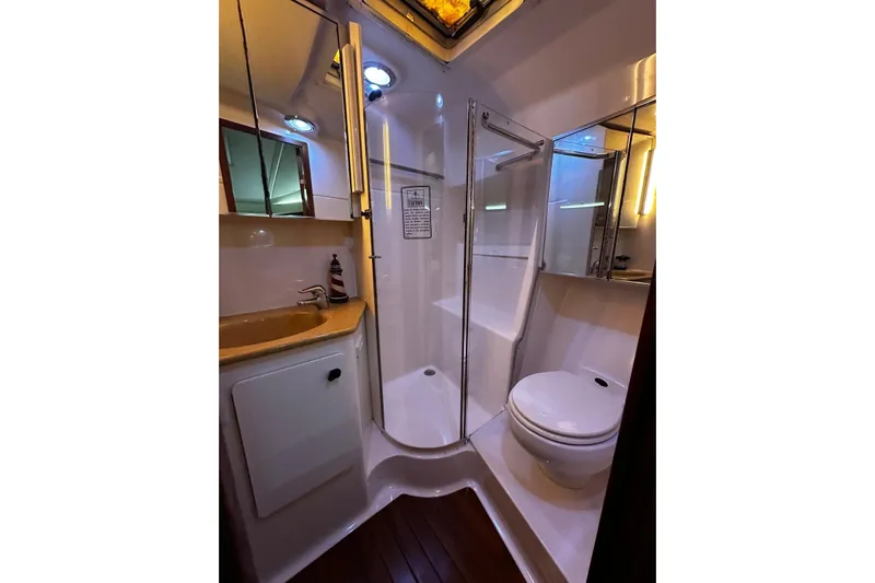  Yacht Photos Pics Bathroom interior of 2003 Tiara Yachts 4000 Express with shower and toilet.