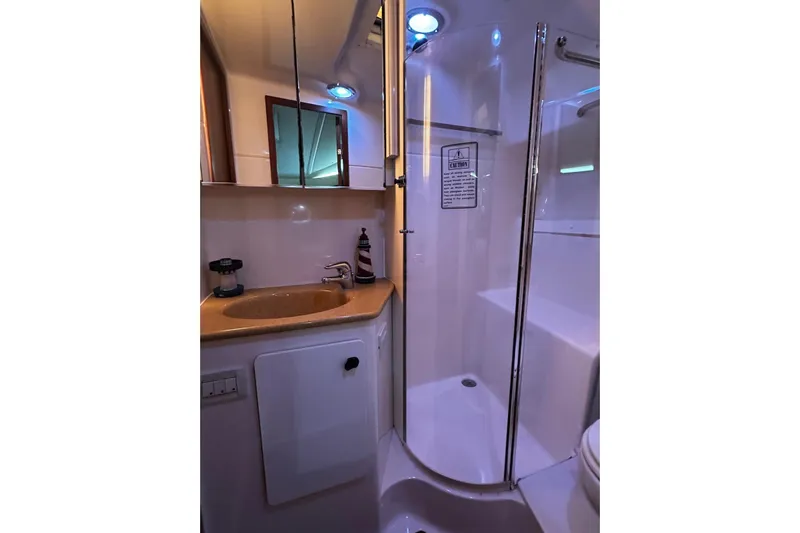  Yacht Photos Pics Bathroom interior of 2003 Tiara Yachts 4000 Express with shower and sink.