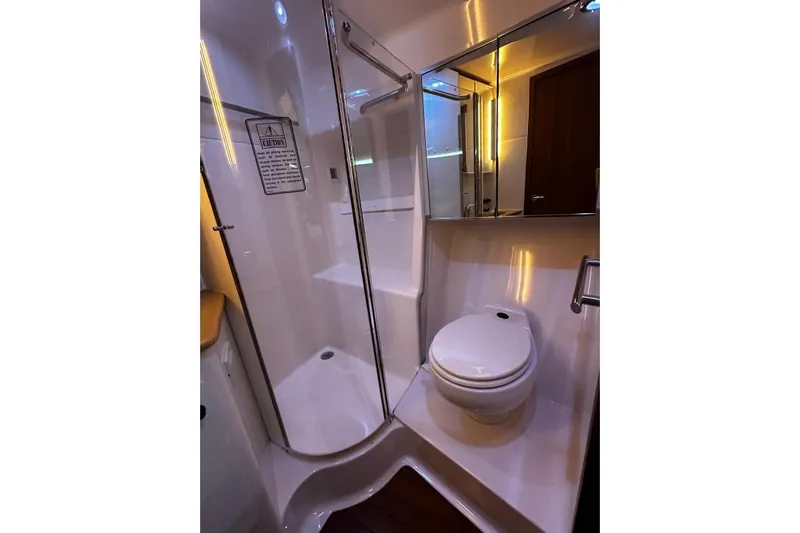  Yacht Photos Pics Luxurious bathroom in 2003 Tiara Yachts 4000 Express, featuring shower and toilet.