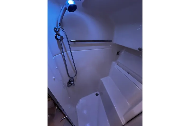  Yacht Photos Pics Shower area in 2003 Tiara Yachts 4000 Express, featuring modern fixtures and ambient lighting.