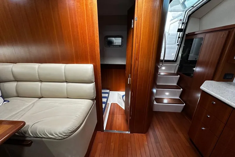  Yacht Photos Pics Luxurious 2003 Tiara Yachts 4000 Express interior with wood finish and comfortable seating.