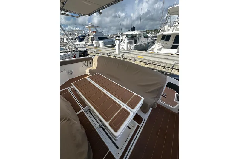  Yacht Photos Pics 2003 Tiara Yachts 4000 Express, docked with covered seating area, marina view.