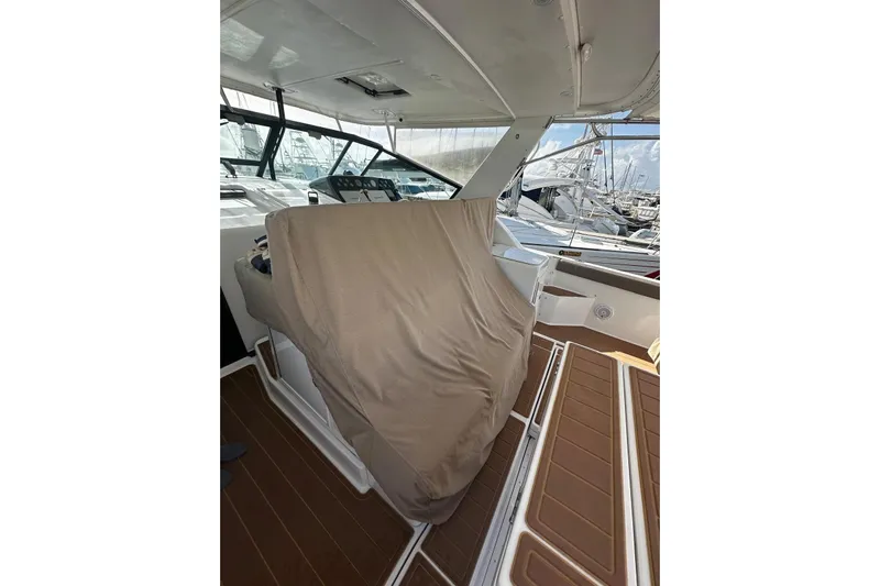  Yacht Photos Pics 2003 Tiara Yachts 4000 Express interior with covered seating and dashboard view.