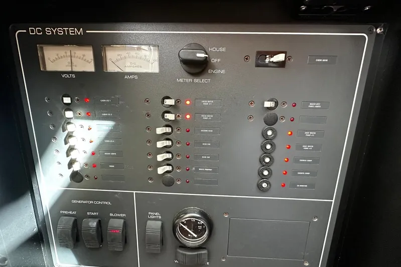  Yacht Photos Pics Control panel of a 2003 Tiara Yachts 4000 Express, featuring DC system gauges and switches.