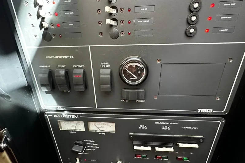  Yacht Photos Pics Control panel of a 2003 Tiara Yachts 4000 Express, featuring generator and AC system controls.