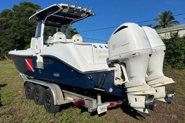  Yacht Photos Pics 2019 Everglades 290 Center Console boat on trailer with twin Yamaha engines.