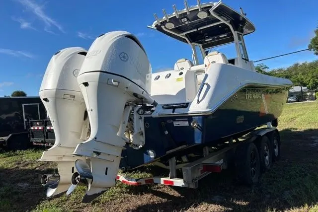  Yacht Photos Pics 2019 Everglades 290 Center Console boat with dual outboard engines on a trailer.