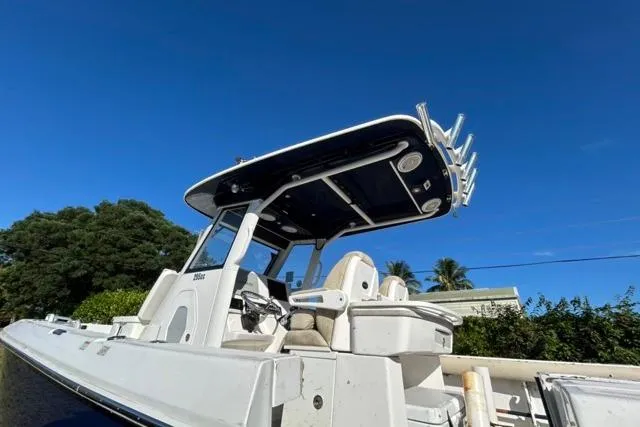  Yacht Photos Pics 2019 Everglades 290 Center Console boat with T-top against clear blue sky.