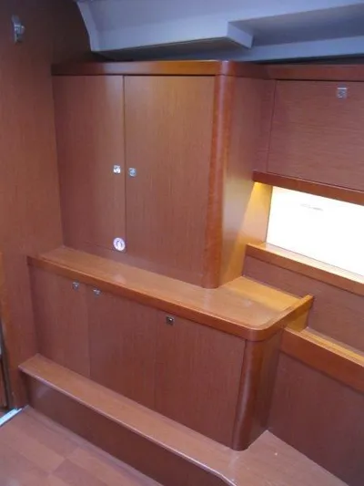 Hey Jude III Yacht Photos Pics Interior cabinetry of 2015 Beneteau Oceanis 45 yacht, featuring sleek wooden design.